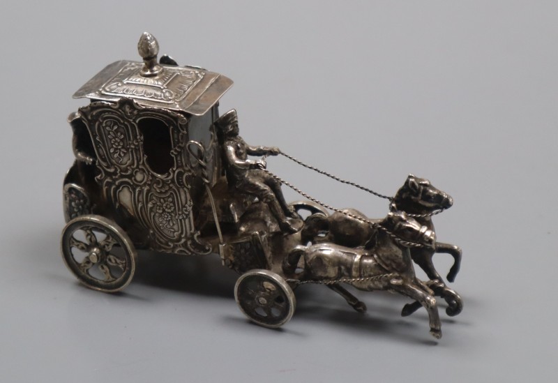 An early 20th century German silver miniature group of a coach and horses